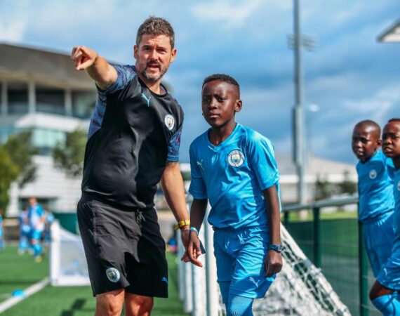 Manchester City FC Summer Camp Boys Trainer Pointing